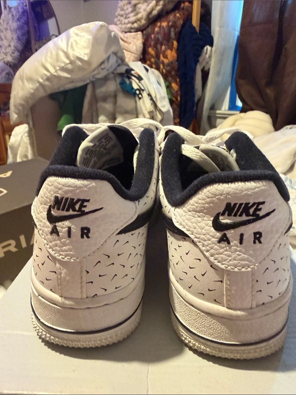 Nike White Low-Top Sneakers with Black Swoosh